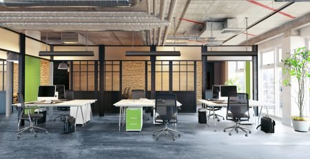 Open plan office with Comfortline Excel infrared ceiling heating panels above workstations on a concrete floor