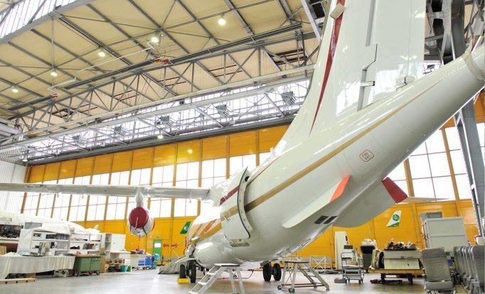 InfraSchwank overhead tube heater installed in commercial aircraft hangar