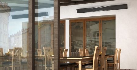 Comfortline infrared heater installed above an outdoor restaurant terrace dining area