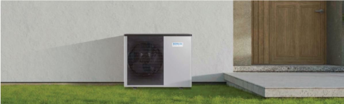 domusa-banner Domusa Teknik heat pump outdoor unit installed beside residential home entrance